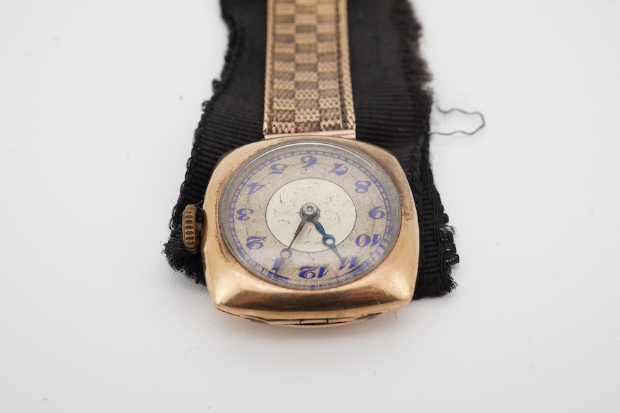 A lady's 9ct gold manual wind lapel watch, with blue enamelled Arabic dial and a 9ct mounted black sash suspension brooch, gross weight 15.5 grams. Condition poor to fair